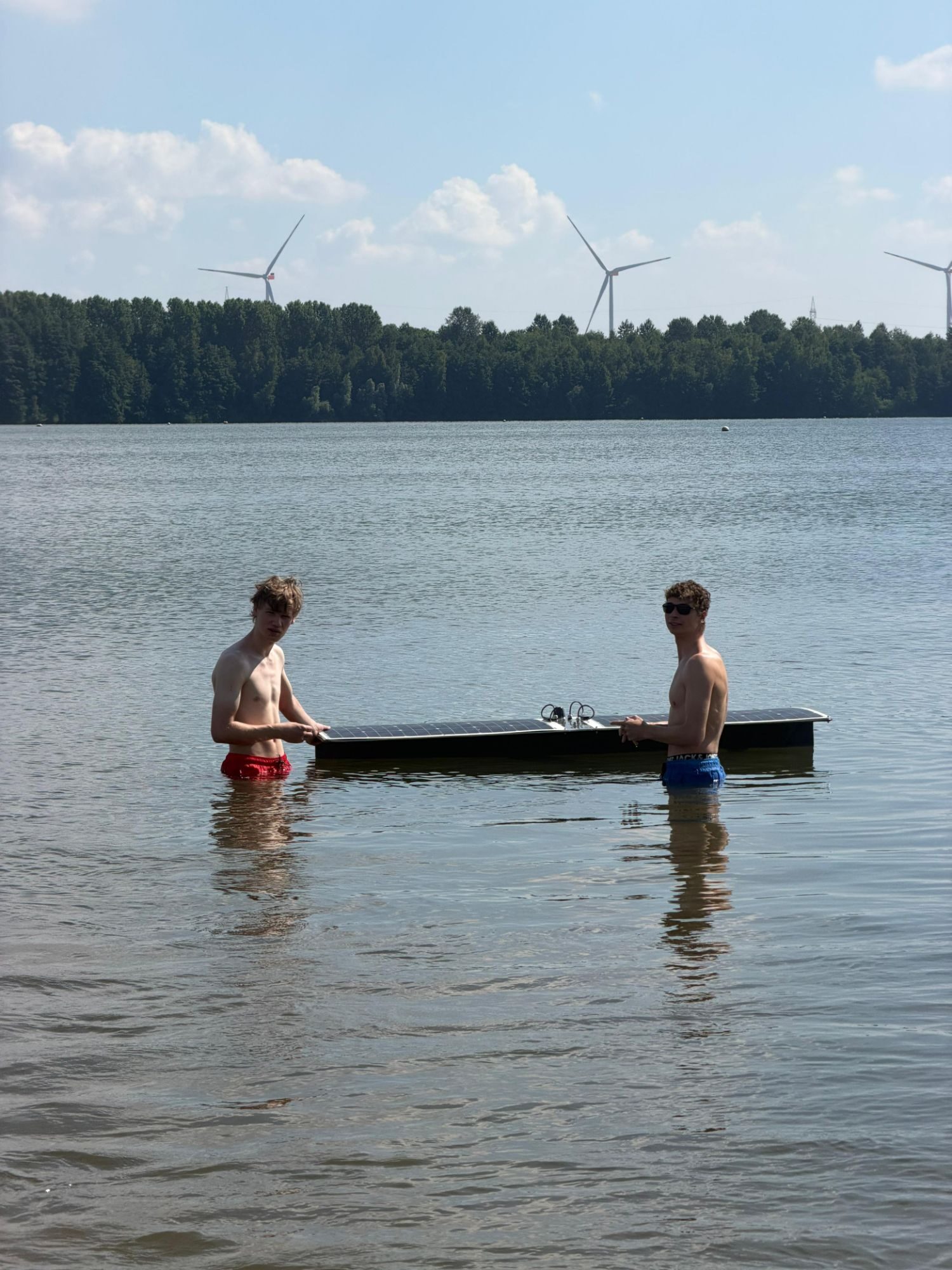 Team members handling the boat in the water